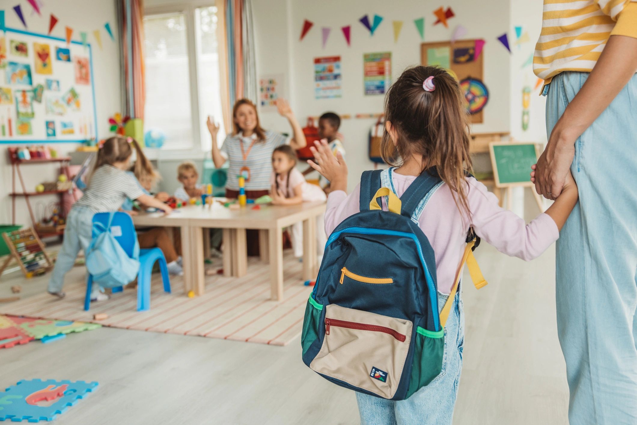 Children learning in a classroom at Loving Arms Academy