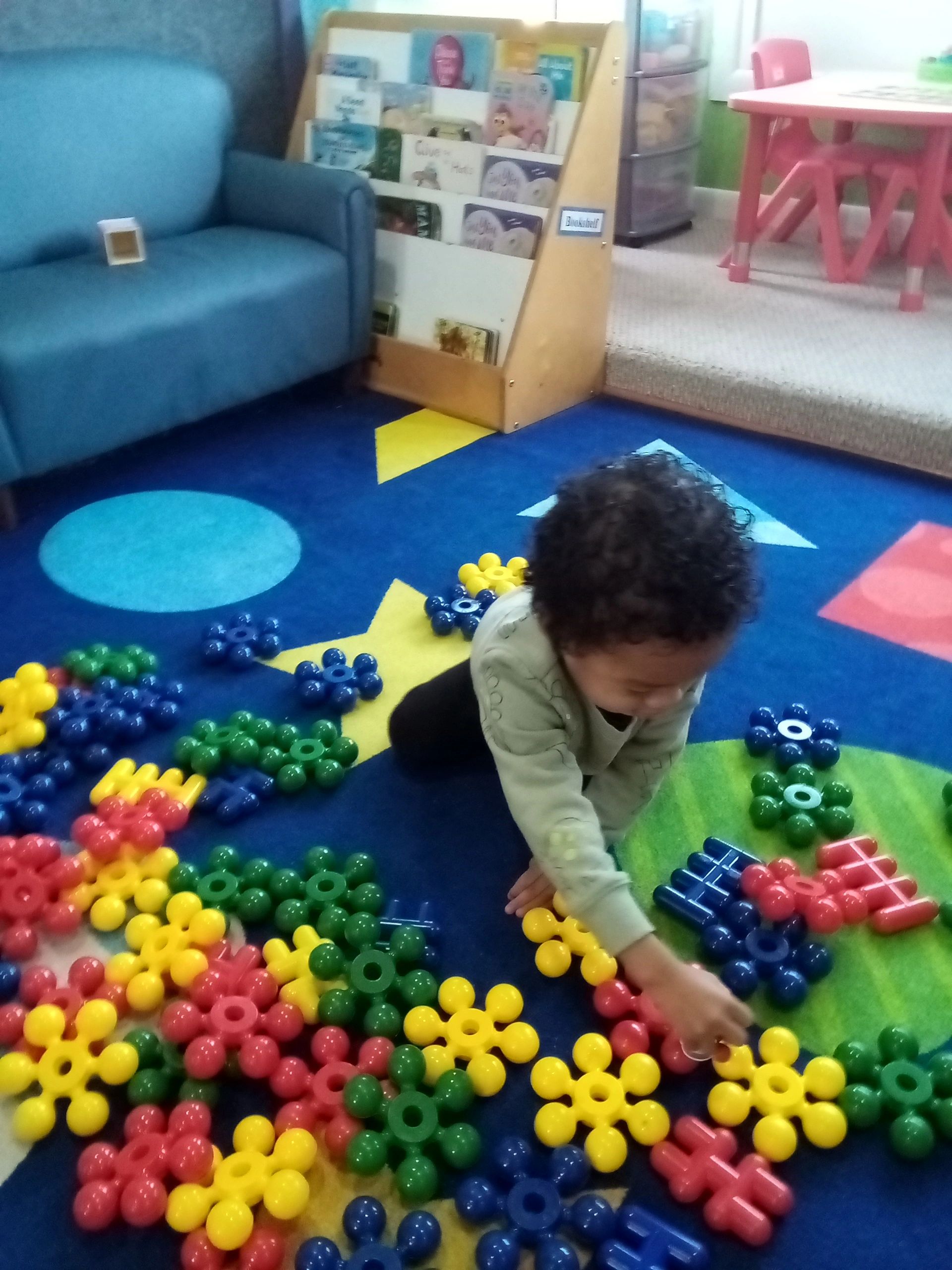 Child learning with colorful manipulatives